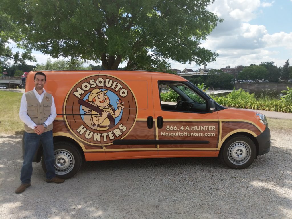 Mosquito Control Company Owner in Boca Raton standing with Mosquito Hunters van