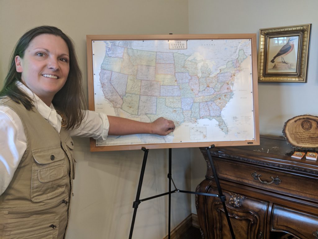 Mosquito Control Company owner pointing at map