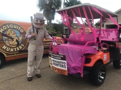 Gunther from Mosquito Hunters at Christmas Golf Cart Parade