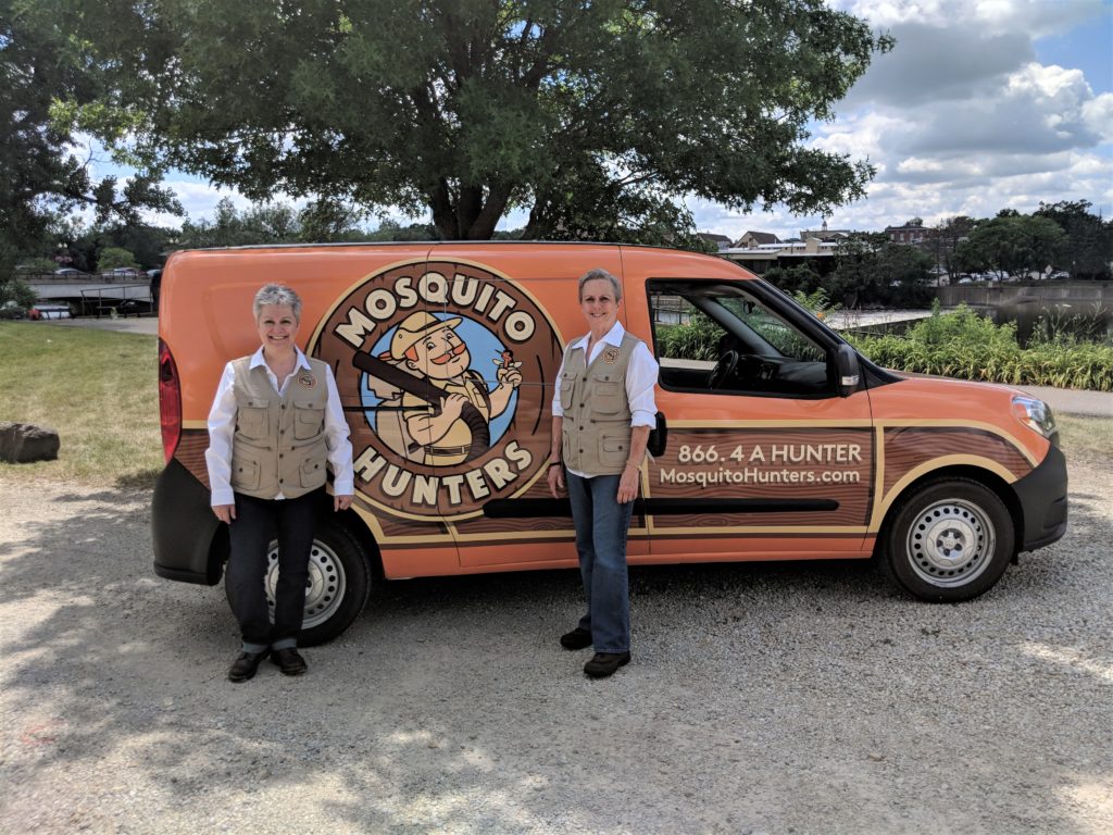 Mosquito Hunters Lafayette Owner standing with van