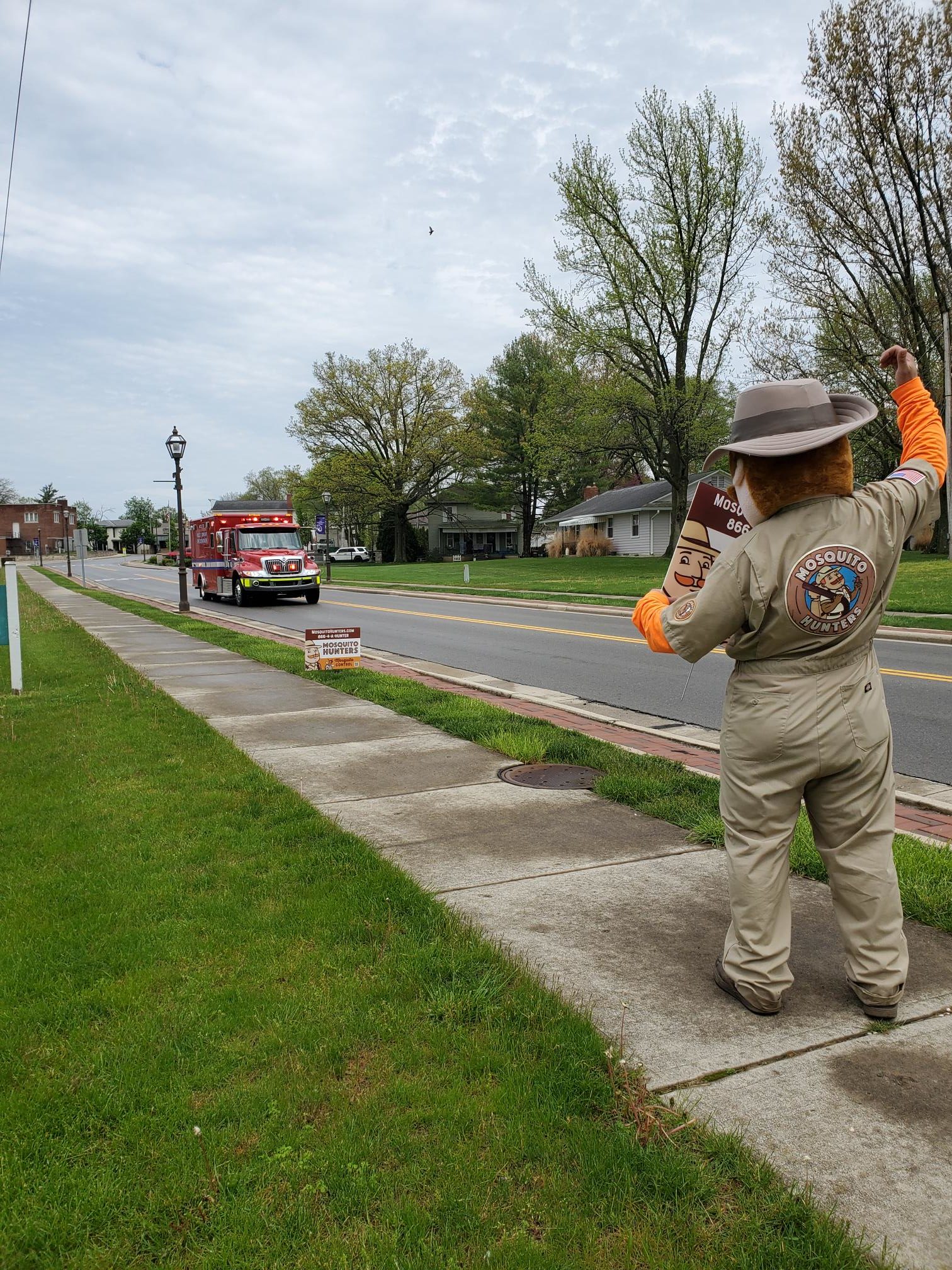 Mosquito Hunters Gunther waiving to Pickerington drivers